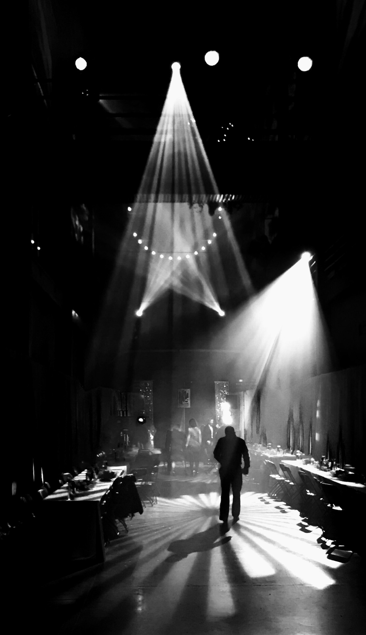 Event production, spotlights over a live venue